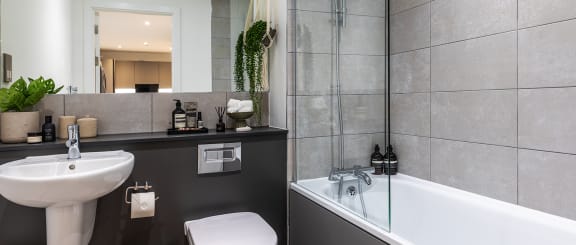 a bathroom with a sink toilet and a tub