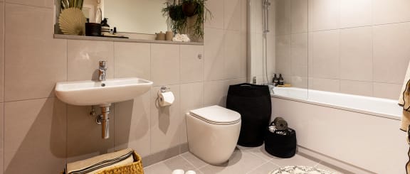 a bathroom with a sink toilet and a tub