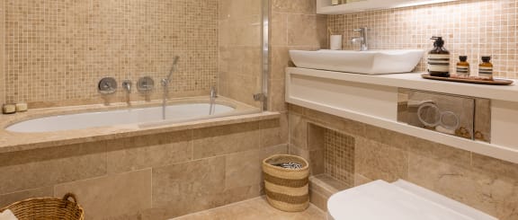a bathroom with a sink toilet and a tub