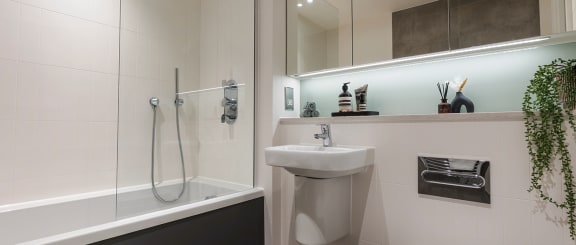 a bathroom with a sink toilet and a tub
