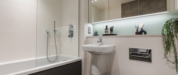 a bathroom with a sink toilet and a tub