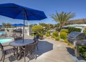 Thumbnail 5 of 33 - View of community grill and table with umbrella