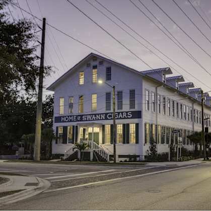 a blue and white building on the corner of a street