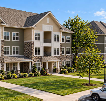 A large, well-maintained apartment complex with multiple buildings and landscaped gardens.