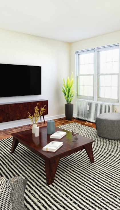 a living room with a coffee table and a television