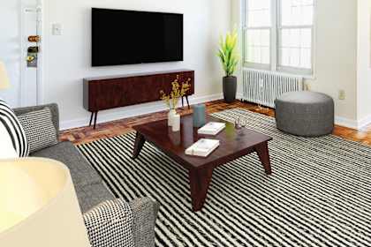 a living room with a coffee table and a television