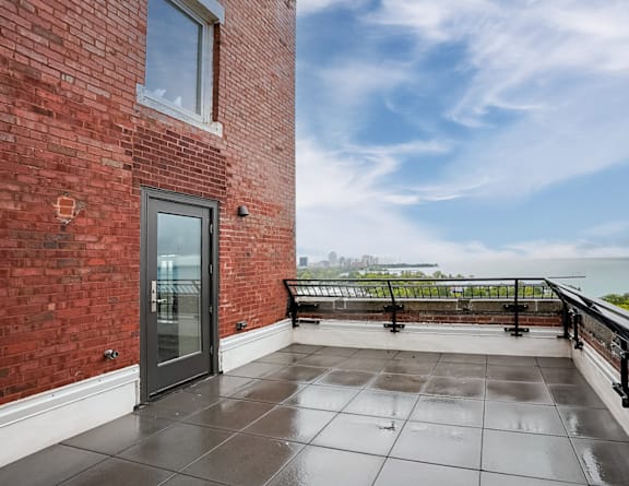 the private balcony has a view of the lake and the city