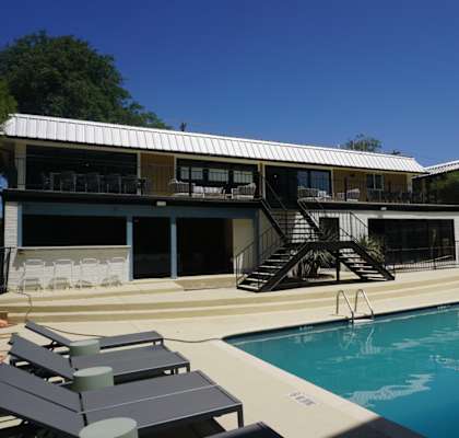 a swimming pool in front of a building