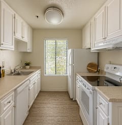 A kitchen with white cabinets and appliances.at Camino Creek, ROHNERT PARK, CA