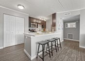 Thumbnail 16 of 111 - Renovated Kitchen with white interior at Woodland Ridge Apartments in Woodridge, IL