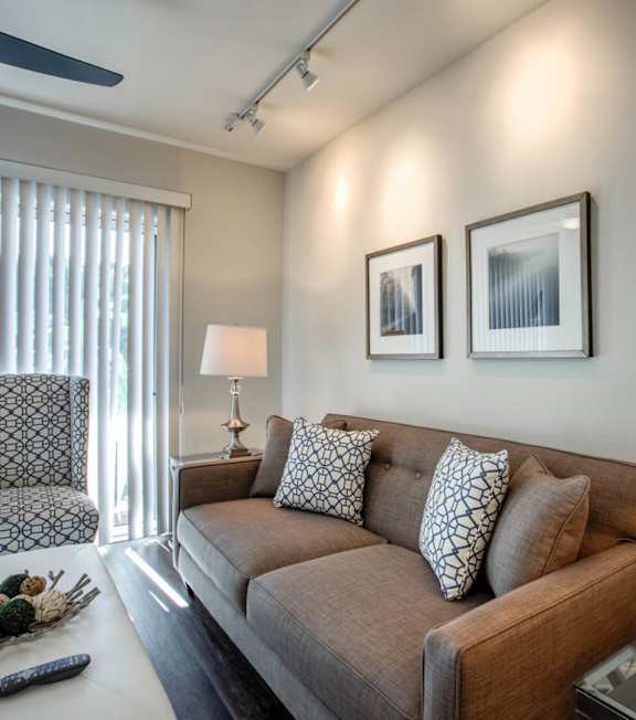 a living room with a spiral staircase and a couch and a table