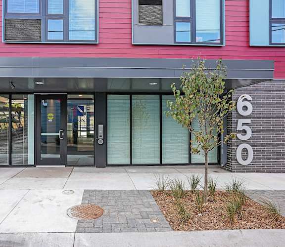 The image shows the front of a building with the number 650 on it.