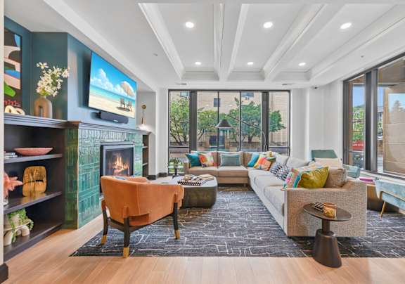 a living room with a couch and a fireplace