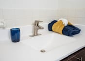 Thumbnail 24 of 46 - White sink in a bathroom at Countryside Estates Apartments, Plymouth, 55441