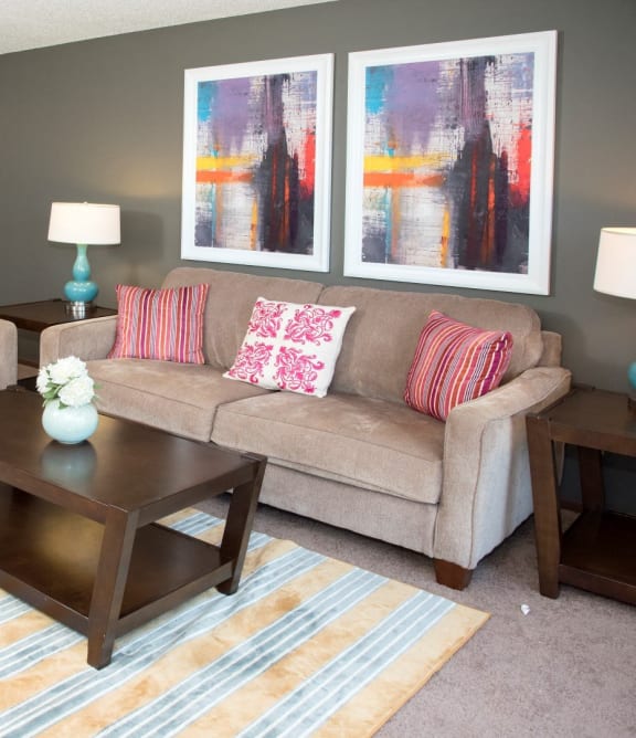 a living room with couches and a coffee table