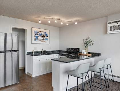 a kitchen with a counter top and a refrigerator