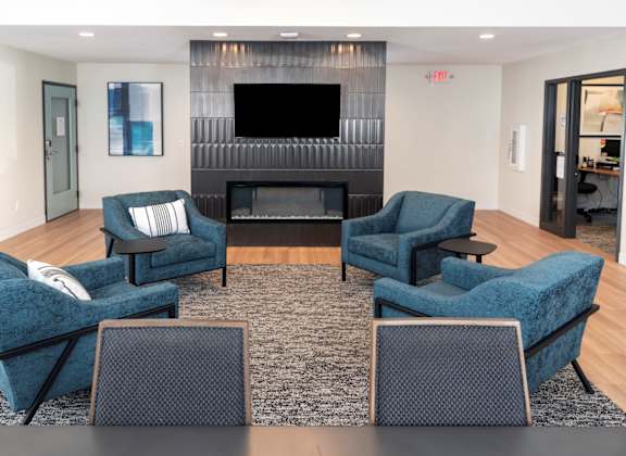 a living room filled with furniture and a fire place