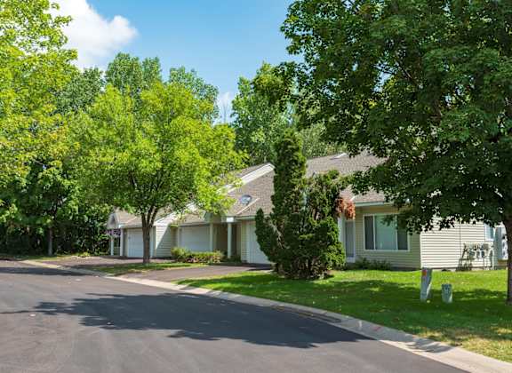a street in front of a row of houses
