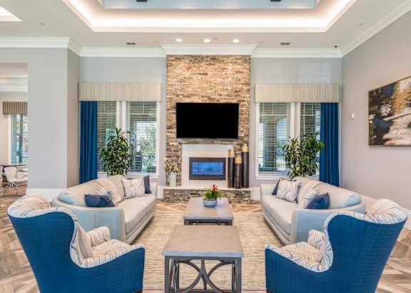 Clubhouse interior with sofa at The Oasis at Crosstown, Florida, 32807