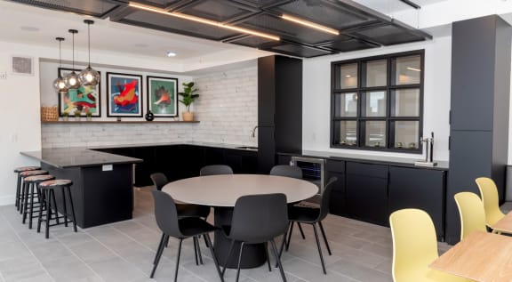 a rendering of a communal area with a table and chairs at Tyler Street Stacks, Minnesota