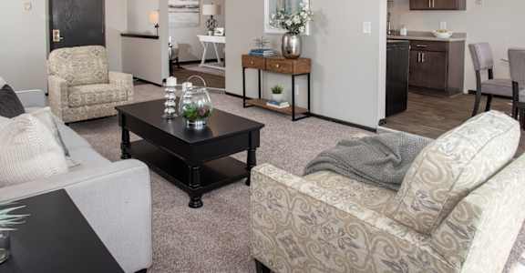 one plus den model, view of living room looking at kitchen, living room and den