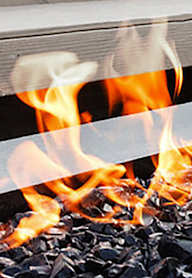 A close up of a fire burning in a fireplace.