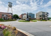 Thumbnail 26 of 35 - a roundabout in front of a building with a water tower in the background at East 51 At Rocketts Landing, Richmond, 23231