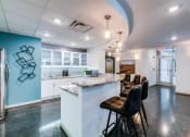 Thumbnail 21 of 35 - a kitchen with a counter top next to a doorway at East 51 At Rocketts Landing, Richmond, 23231