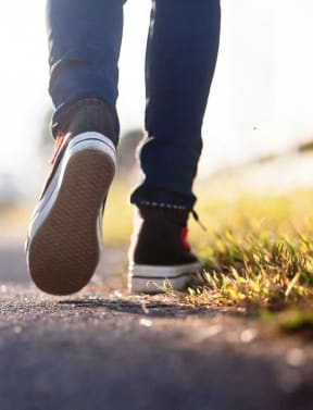 a close up of a person walking down a road