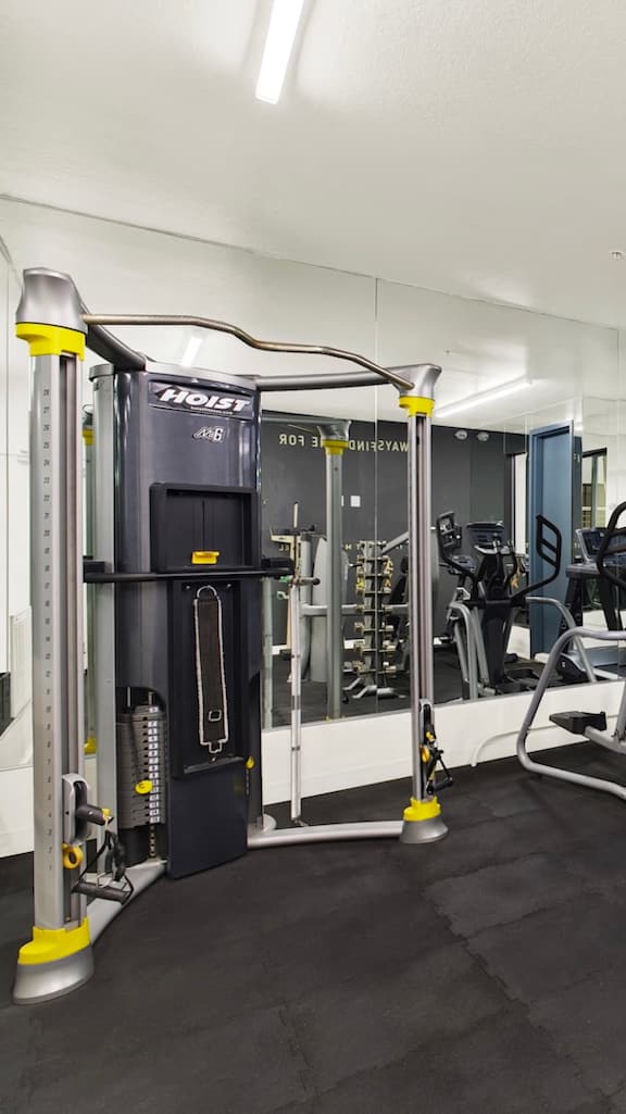 A gym with a variety of equipments.