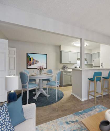 A living room with a dining table and chairs. at The Beacon, Huntsville, AL, 35816
