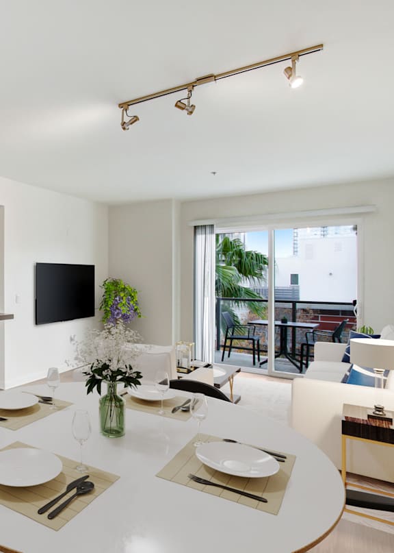 A modern kitchen with a dining table set for two.at Vues on Gordon, Los Angeles, 90028