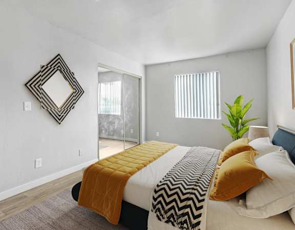 a bedroom with a bed and a sliding glass door