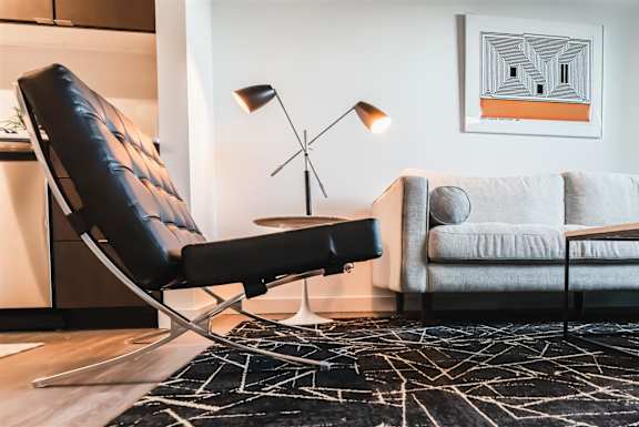 a living room with a couch and a chair