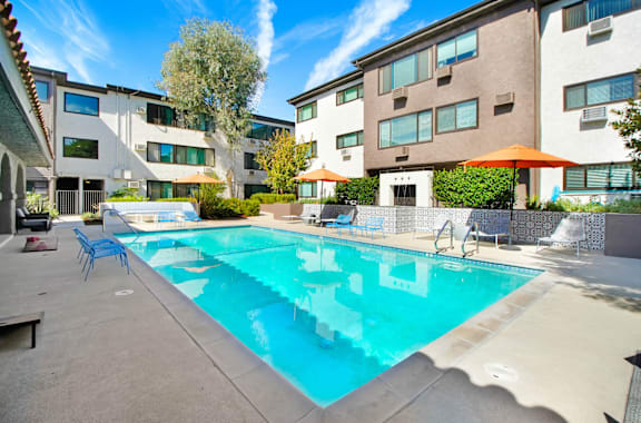 our apartments have a pool and lounge areas with umbrellas