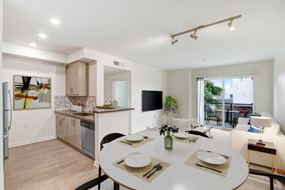 A modern kitchen with a dining table set for two.at Vues on Gordon, Los Angeles, CA 90028