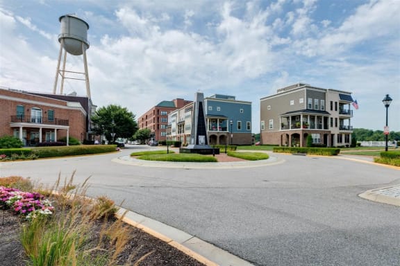 a roundabout in front of a building with a water tower in the background at East 51 At Rocketts Landing, Richmond, 23231