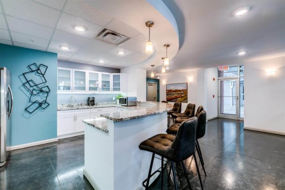 a kitchen with a counter top next to a doorway at East 51 At Rocketts Landing, Richmond, 23231