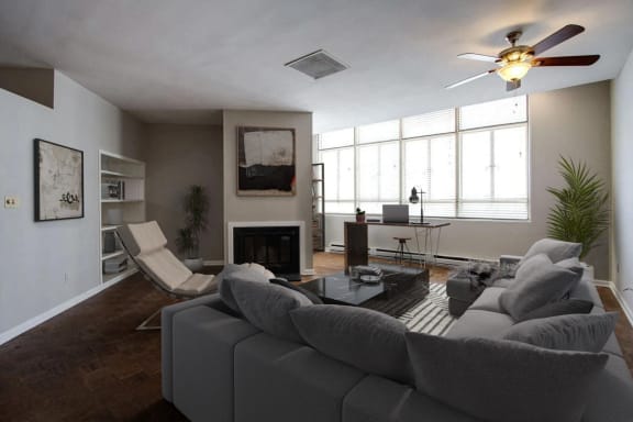 a living room with a couch and a ceiling fan  at Metro67, Memphis, TN, 38103