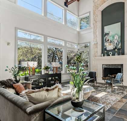 A living room with a fireplace and a couch.