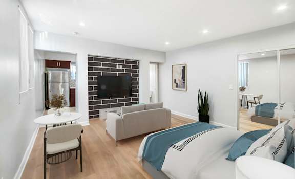 a living room with a bed and a couch
