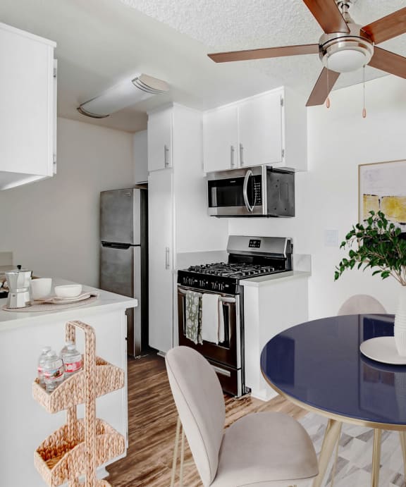 our modern kitchen and dining room with a table and chairs