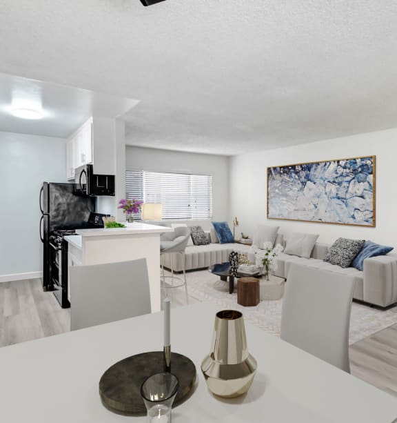 an open living room and kitchen with a white table