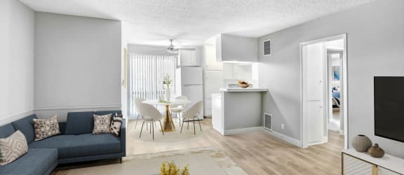 an open kitchen and dining room with a white table and chairs