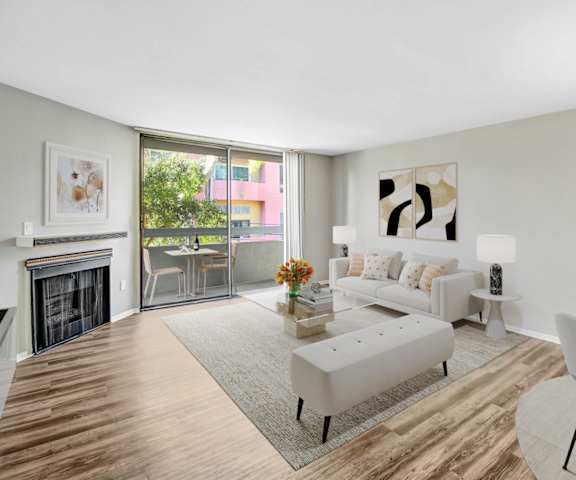 a living room with a couch and a table and a fireplace