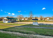 Thumbnail 4 of 5 - a park with a baseball field and a pavilion at White Springs Senior Living, Warrenton, 20186