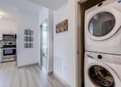 Thumbnail 8 of 35 - a washer and dryer in a laundry room at East 51 At Rocketts Landing, Richmond, 23231