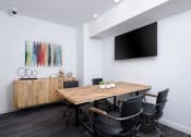 Thumbnail 35 of 50 - Collaborative workspace with conference table and television