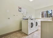 Thumbnail 29 of 33 - Laundry facility with concrete flooring