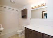 Thumbnail 31 of 46 - White bathroom at Countryside Estates Apartments, Plymouth, MN
